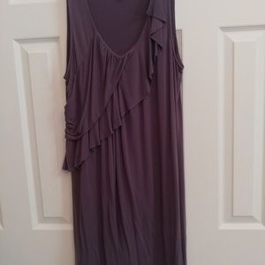 Sleeveless dark gray ruffle dress.